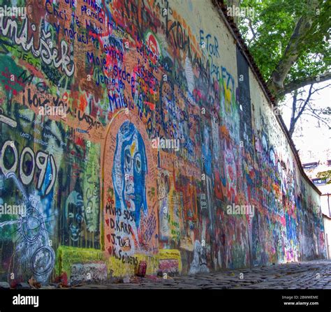 The Lennon Wall or John Lennon Wall in Prague - Praha, Czech Republic. Graffiti inspired by John ...