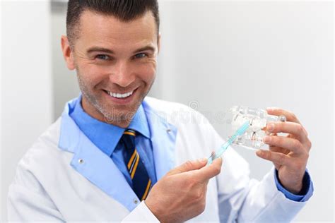 Dentist Doctor Shows How To Brush Teeth. Dental Clinic Stock Image ...