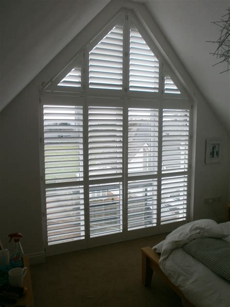 A tall gable end window with phoenix wood shutters. | Living room ...