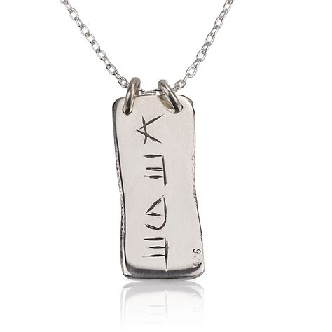 Luck & Love. A rectangular shape silver pendant with ancient Hebrew ...