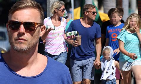 Gary Barlow and wife Dawn treat their children to vegetable juices after enjoying a hike in the ...