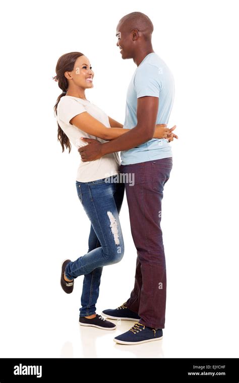 cheerful black couple hugging over white background Stock Photo - Alamy