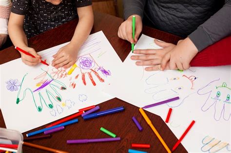 Premium Photo | Children with down syndrome drawing