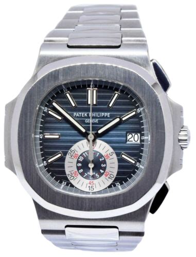 A silver Patek Philippe watch with a blue face and silver accents.