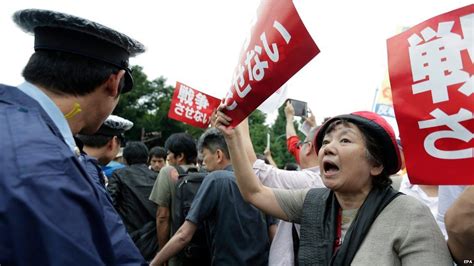 Japan military legislation changes draw protests - BBC News