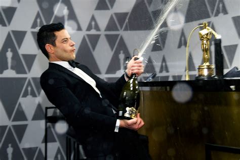 Rami Malek Rebounds from Oscars Stage Fall, Spraying Champagne at Star-Studded Afterparty