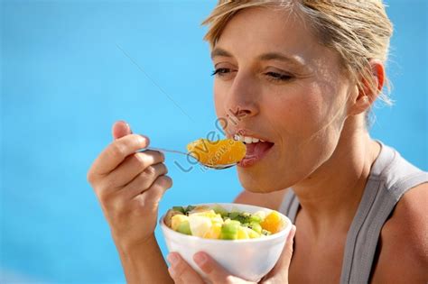 Woman Eating Fruit Salad By Poolside Photo Picture And HD Photos | Free Download On Lovepik