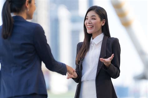 Premium Photo | Close up, handshake of two business women on the ...