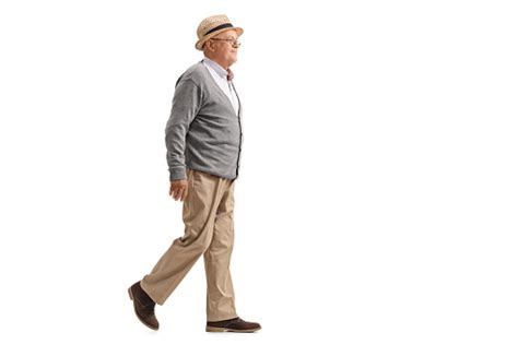 Elderly Man Walking And Smiling Stock Photo - Download Image Now - iStock