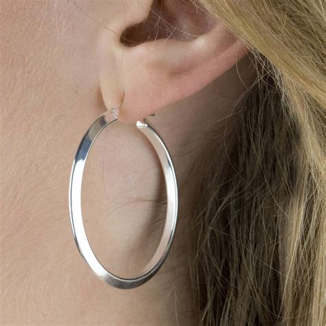 sterling silver hoop earring with a triangular finish by the london earring company ...