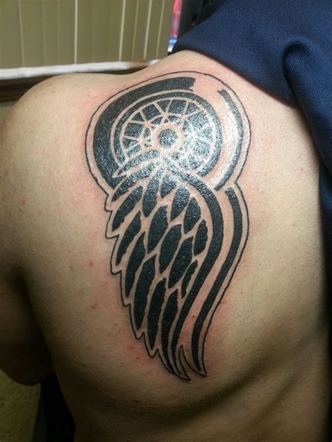 red wing tattoo meaning - Christian Garber