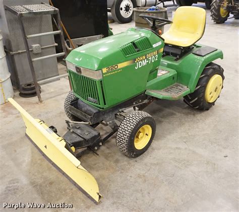 John Deere 320 lawn mower in Olathe, KS | Item EJ9277 sold | Purple Wave