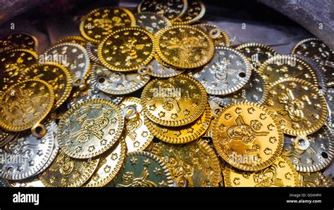 Fake gold and silver coins closeup Stock Photo - Alamy