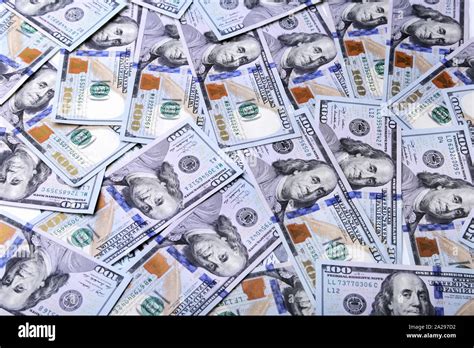 A pile of dollar bills. Background from american money one hundred dollars Stock Photo - Alamy