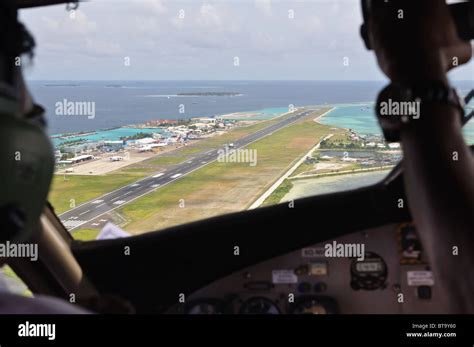 Aircraft cockpit. View on Male airport and takeoff airplane Stock Photo ...