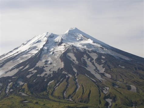 Vsevidof volcano with fresh snowfall near the summit and a light ...