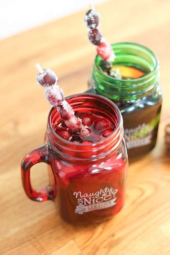 Christmas mason jar mugs with frozen cherry stirrers on wo… | Flickr