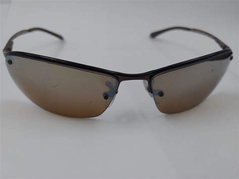 PAIR OF AUTHENTIC POLARIZED RAY-BAN SUNGLASSES (RB3183) - Able Auctions