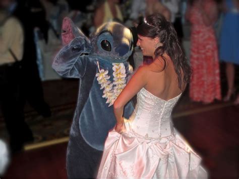 This Walt Disney World Bride shares a dance with Stitch from "Lilo and Stitch"... how awesome is ...