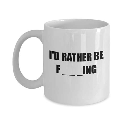 a white coffee mug that says i'd rather be f ing