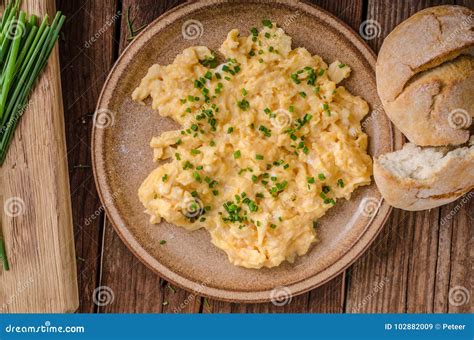 Scrambled eggs with herbs stock image. Image of food - 102882009