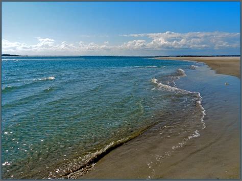 the water is crystal blue and clear on this beach shore line, with ...