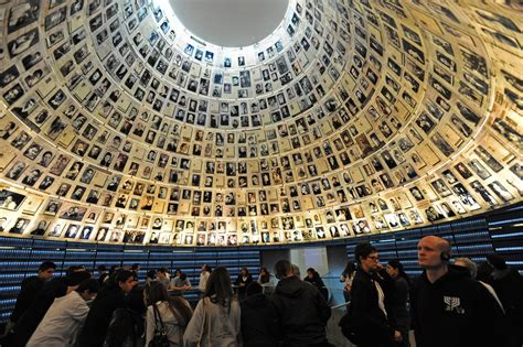 Tourists visit the Hall of Names in the Yad Vashem Holocaust Museum in Jerusalem on the eve of ...