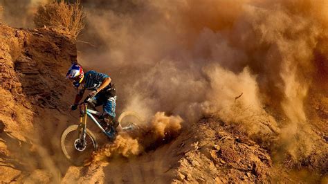 Download Thrilling MTB Ride on Sandy Mountain Trail Wallpaper | Wallpapers.com