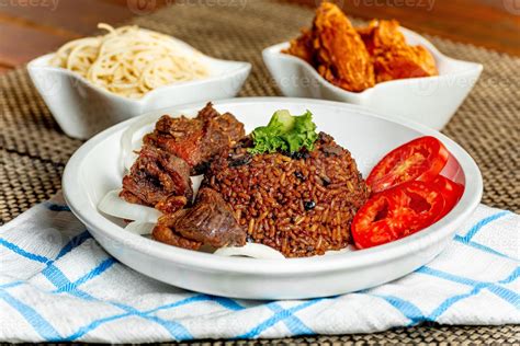 jollof rice with mean - vegetable and fruits 20069105 Stock Photo at Vecteezy