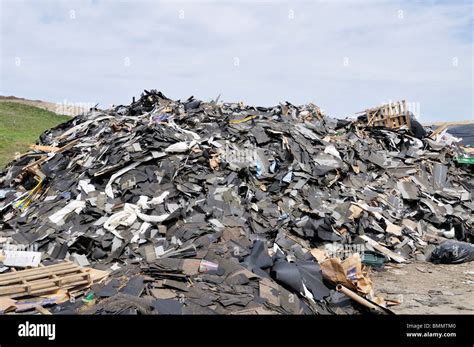 Asphalt shingles construction debris at landfill in Bourne, Massachusetts Stock Photo - Alamy