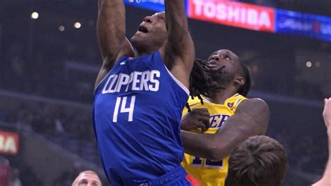 Los Angeles Clippers guard Terance Mann (14) drives past Los Angeles ...