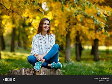 Girl Sitting On Stump Image & Photo (Free Trial) | Bigstock