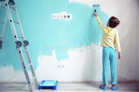 Child painting the wall stock image. Image of repair - 37670531