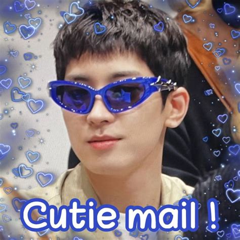a young man wearing blue sunglasses with hearts on it and the caption cutie mail