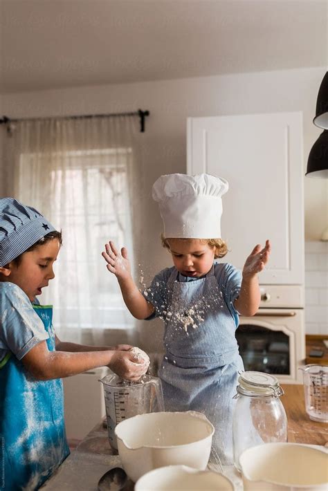 "Children Playing With Flour" by Stocksy Contributor "Dejan Ristovski ...