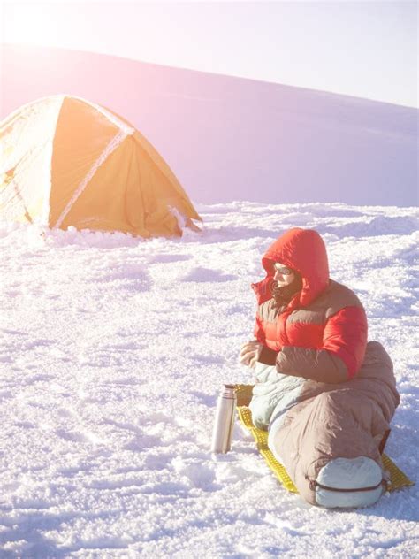 The Man is Lying in a Sleeping Bag Near the Tent. Stock Image - Image ...