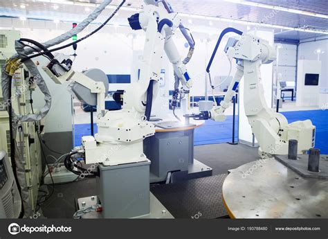 Assembly line with the robotic arms. Stock Photo by ©Scharfsinn 193788480