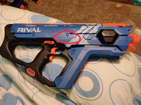 Why do some Nerf Perses blasters have black text where it says "MXIX-5000" but some don't. I ...