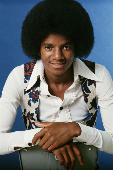 Download Young Michael Jackson looking cool in his signature style. | Wallpapers.com