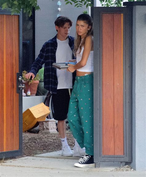 Zendaya, Tom Holland confirm they're dating with kiss pics