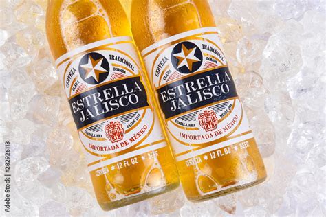 IRVINE, CALIFORNIA - MARCH 21, 2018: Two bottles of Estrella Jalisco Beer in ice closeup ...