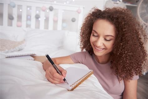 Free Photo | Beautiful teenage girl writing diary