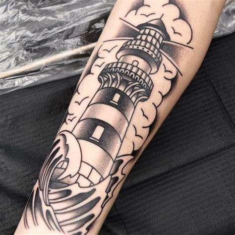 11 LIGHTHOUSE TATTOOS IDEAS + MEANINGS - UPDATED 2024