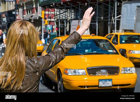 woman hailing New York City taxi Stock Photo - Alamy