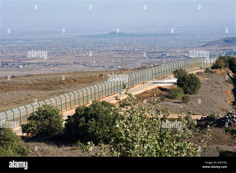 The fence of the border between Israel and Syria as seen from a hill on ...