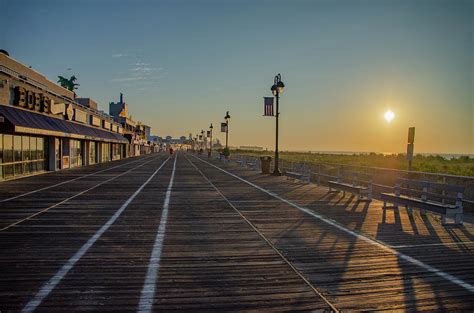 On the Boardwalk at Sunrise - Ocean City New Jersey Photograph by Bill ...