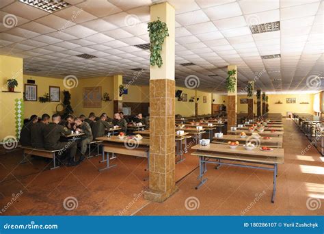 At A Mess Hall: Soldiers Sitting At Set-out Tables And Eating Editorial ...