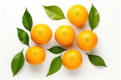 Premium AI Image | Juicy orange fruit with green leaves on a white backdrop