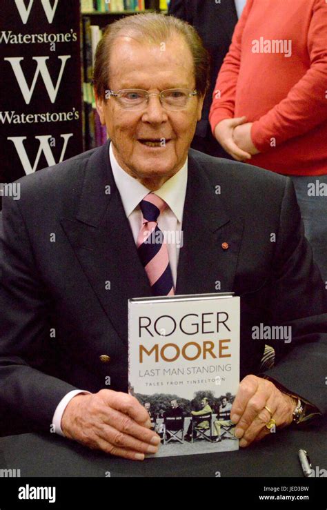 Sir Roger Moore signing copies of his autobiography 'Last Man Standing: Tales from Tinseltown ...