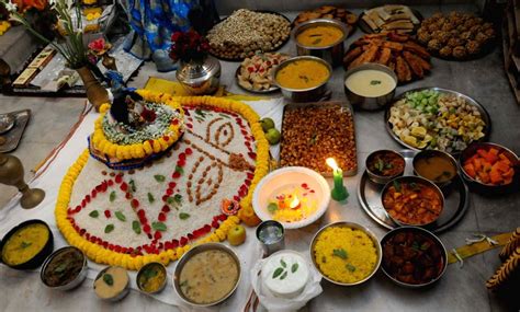 : Kolkata :Hindu devotees perform prayers with varieties of food to the Idol of Goddess Gopal ...